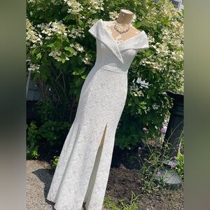 Xscape Ivory Lace Wedding Dress. Modern off the shoulder sleek and chic